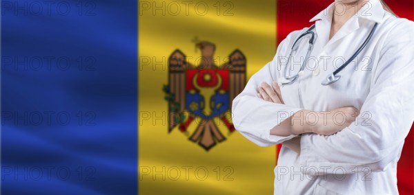 Doctor with crossed arms on Moldova flag. Moldova health and care concept. Female doctor on Moldova