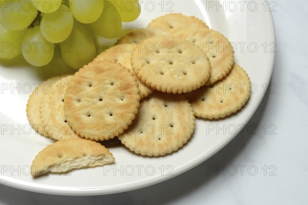 Crackers, crackers with grapes on a plate