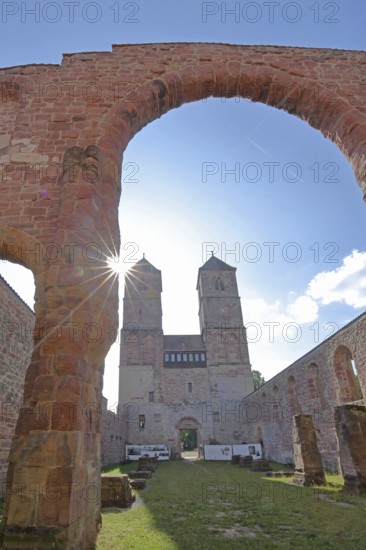 Romanesque St. Mary's Collegiate Church backlit with archway, twin towers, church ruins, interior