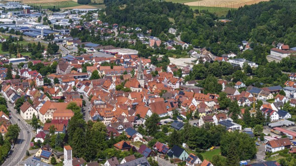 Town view of Münsingen on the Swabian Alb with town hall and church. Drone photo. Town centre of