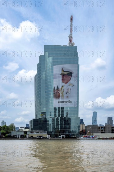 Tower block National Telecom Public Company Limited with image of Thailand King Maha