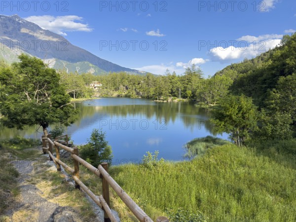 View of small picturesque romantic mountain lake Lago Grande near Moncenisio in Val Cenischia in