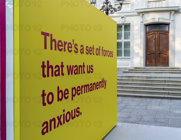 Tony Cokes, visual artist and educator, display panel at the Palais Populaire Unter den Linden,