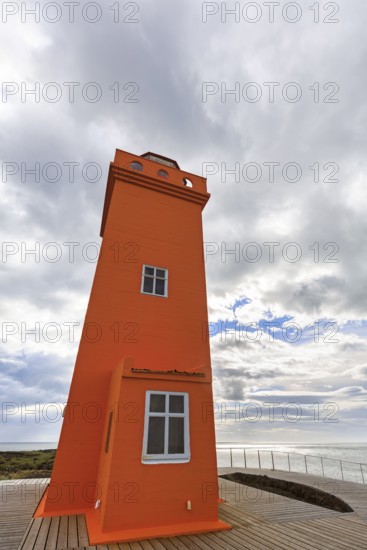 Orange lighthouse Skálasnagaviti or Svörtuloft with wooden boardwalk, Skalasnagi, Öndverdarnes,