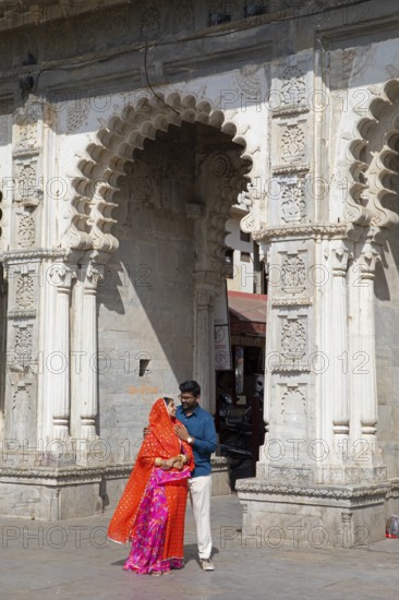 Indian couple at Gangaur Ghat or Gangori Ghat, Udaipur, Rajasthan, India