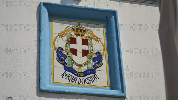 Coastguard, Italian tile coat of arms on a wall with crown and cross motif, Agia Marina, Leros,