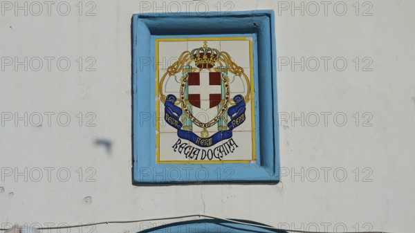 Coastguard, Decorative coat of arms on tiled wall in blue and white tones, Agia Marina, Leros,