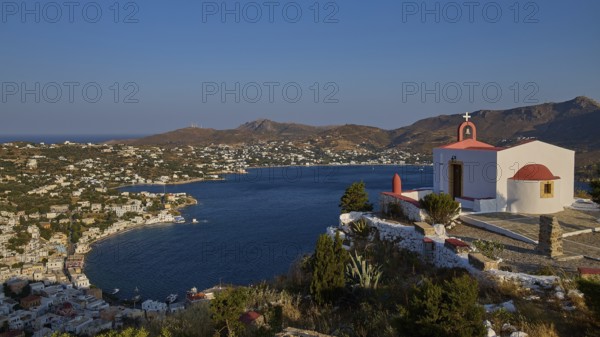 Profitis Ilias Church, Morning landscape with a church overlooking a bay and a village on a gentle