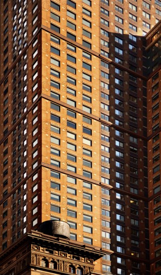 Skyscraper facades, below a wooden water tank on the roof of a residential building, New York