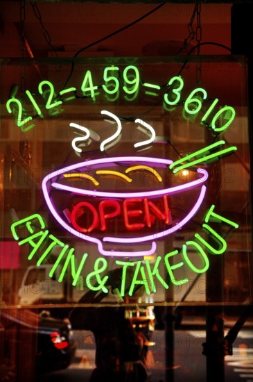 Illuminated advertising at a fast food restaurant, New York City, USA