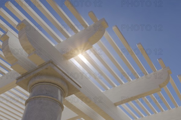 Detail abstract of A beautiful marble and wood pergola patio cover