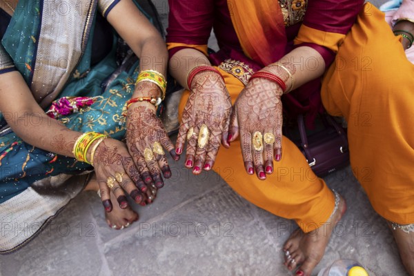 Indian woman show hands painted with henna, Mehrangarh or Meherangarh Fort, Jodhpur, Rajasthan,