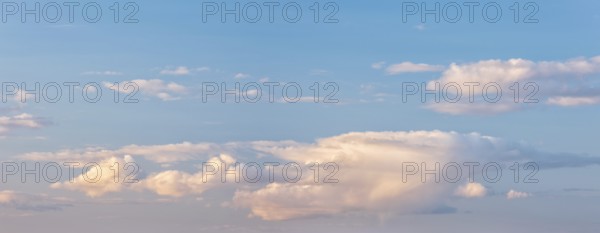 Wallpaper for sky replacement, blue sky with soft white clouds in the evening light