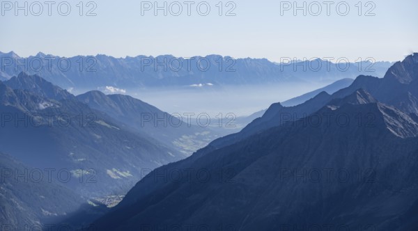 View of the Stubai Valley, mountain silhouettes, from the summit of the Wilder Freiger, Stubai
