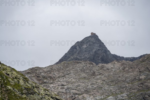 Becherhaus mountain hut on the rocky summit of the Becher, Stubai Alps, near Ridnaun, South Tyrol,