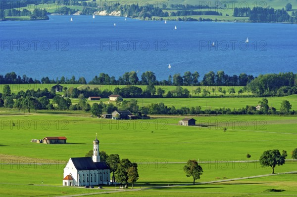 View from Neuschwanstein Castle to the pilgrimage church of St Coloman, Forggensee, Schwangau,