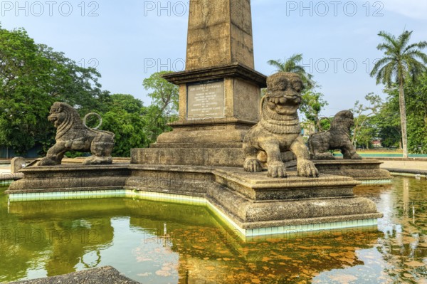 Independence Memorial Hall in Cinnamon Gardens, Lions on the Commemorative water basin in the honor