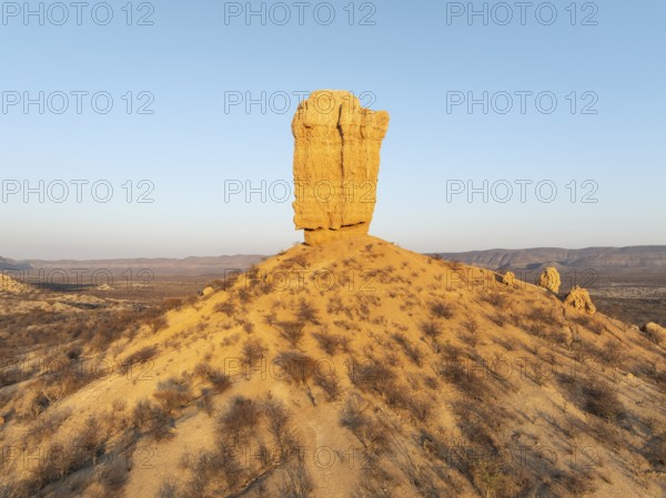 The Vingerklip (rock finger) is surrounded by thornbush and mopane (Colophospermum mopane) savanna.