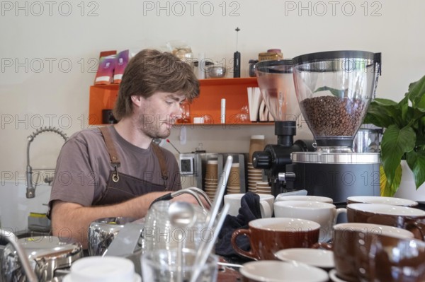 Midland, Michigan - An employee makes coffee at Chef Sergey's Bakery, a popular shop owned by four