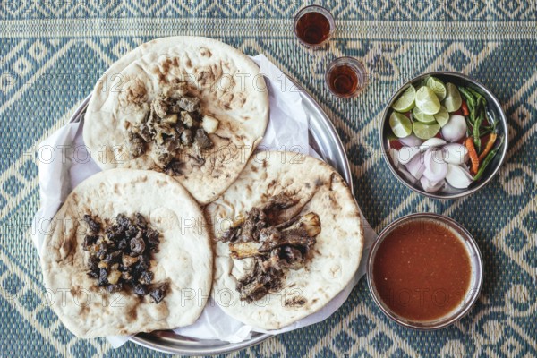 Traditional camel restaurant in Salalah, three kinds of camel meat (dry braised, boiled and