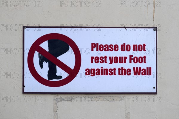 Prohibition sign Please do not lean your foot against the wall, Abu Dhabi, United Arab Emirates