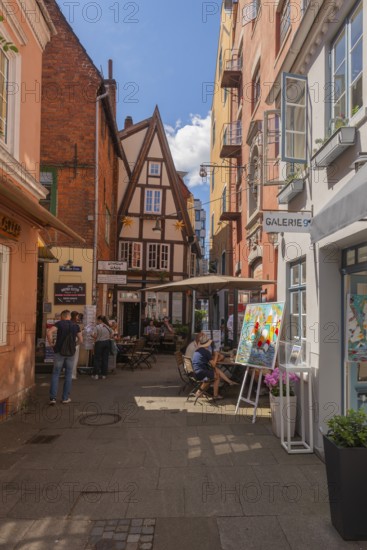 Small square in Wüstestätte alley, renovated Schnoor district with small shops, galleries,