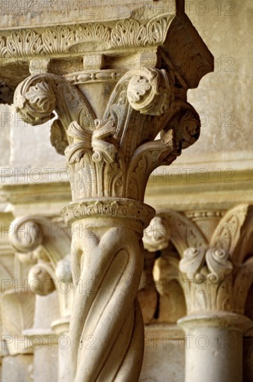 Slender Gothic columns with filigree capitals in the cloister, Gothic basilica of the Cistercian