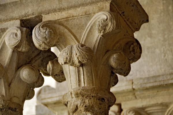 Slender Gothic columns with filigree capitals in the cloister, Gothic basilica of the Cistercian