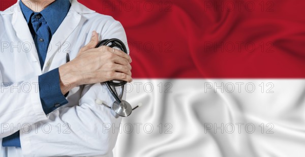 Doctor with stethoscope on Monaco flag. Doctor holding stethoscope on Monaco flag