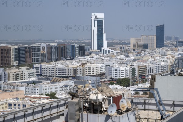 Residential neighbourhood rooftop with satellites, Abu Dhabi, United Arab Emirates