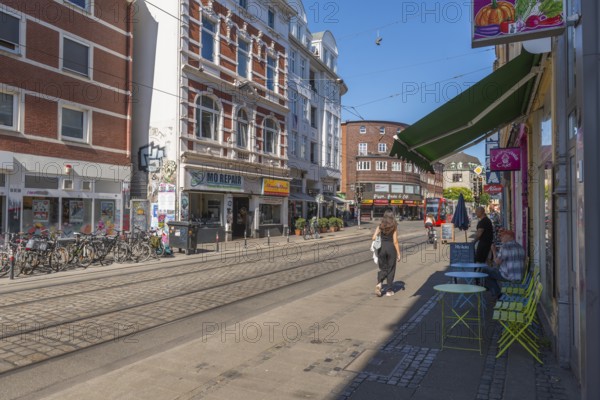 Ostertorsteinweg shopping street in the Ostertor district, tram, bicycles, wide footpath, many