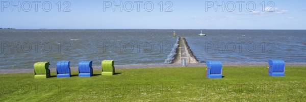 Beach chairs on a blooming meadow on the North Sea coast, GrÃ¼nstrand, Pellworm Island, North Sea,