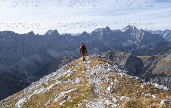 Mountain panorama with picturesque mountain landscape, mountaineers descending from the Gamsjoch,