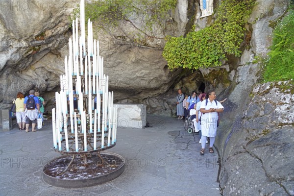 The Grotto of Massabielle in the Holy District in the Marian pilgrimage town of Lourdes, Pyrenees,