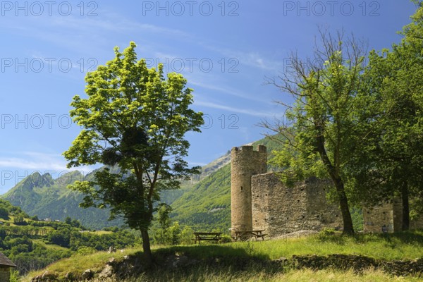 The ruins of the ChÃ¢teau Sainte-Marie castle in Esterre and the mountain landscape near