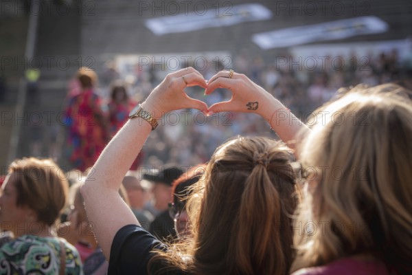 Hands formed into a heart at the Berliner Rundfunk 91.4 Open Air at the Berlin ParkbÃ¼hne Wuhlheide