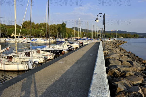 Quay with breakwater made of boulders, Bolsena marina, Porto Turistico di Bolsena, Lake Bolsena,