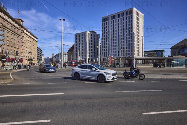 Traffic area, modern architecture, general building development, overhead lines, vehicles, cars,