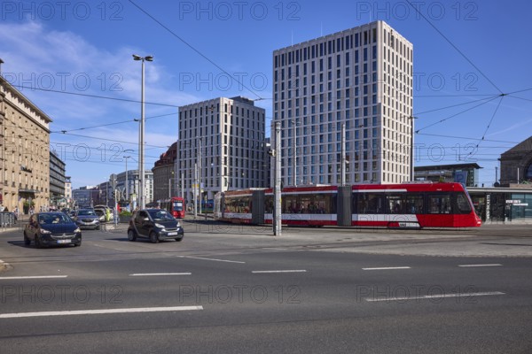 Traffic area, modern architecture, general development, tram, overhead lines, vehicles, lantern,