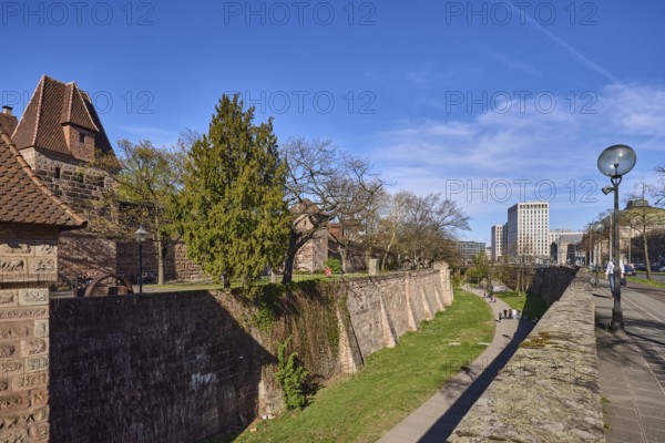 Old town, city fortification, city wall, tower, modern architecture, lantern, trees, lawn, blue