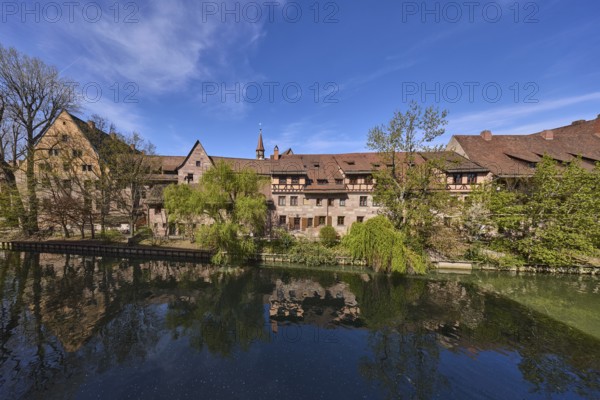 River Pegnitz, historical buildings, trees, symmetrical reflections, water surface, blue sky,