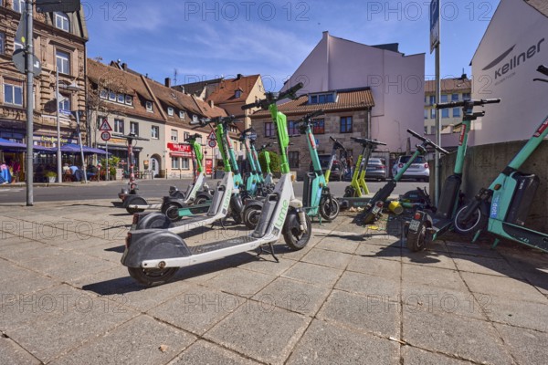 E-scooter in the city, problem, traffic problem, general architecture, pavement, pavement slabs,