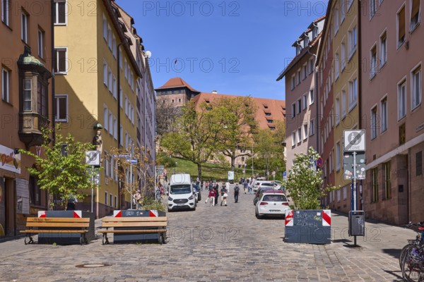 Street, traffic sign end of pedestrian zone, cobblestones, flower pots, benches, historical