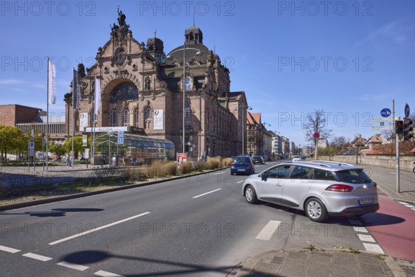 Nuremberg State Theatre, architect Christian Heinrich Seeling, flags, flagpoles, vehicles, opera