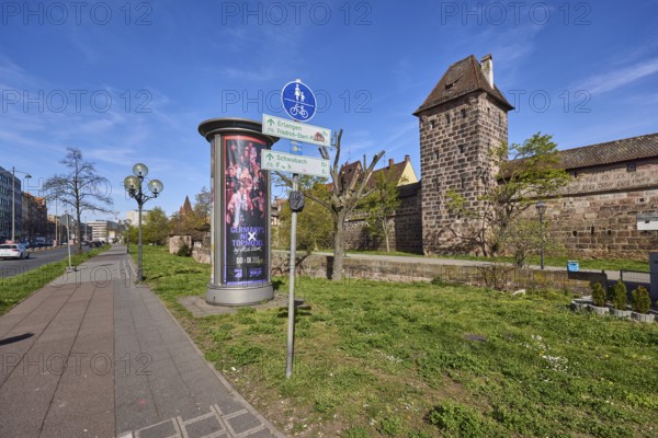 Footpath and cycle path, traffic sign shared footpath and cycle path, advertising pillar, lantern,
