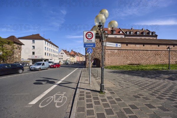 City fortification, city wall, zone 30 sign, additional sign old town, lantern, road marking cycle