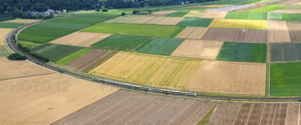 Agricultural area in the Neckarbogen near Lauffen am Neckar. Regional railway on the way. Lauffen