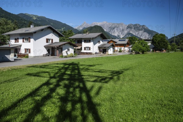 Shadow image of electricity pylons and residential neighbourhood, Schruns, Vorarlberg, Austria