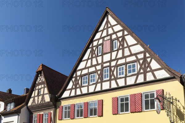 Historic houses with half-timbered gables and shutters in the old town centre of Bad Windsheim,