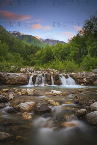 View of a waterfall of the Rio Plima stream in the evening light, long exposure, landscape photo,